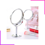 Miroir maquillage double face sur table