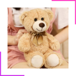 Peluche ours avec ruban satiné